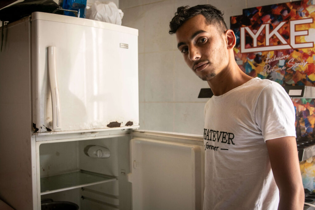 A Syrian refugee in Tripoli, 19-year-old Ahmed Khayro el Abed, owns a refrigerator, but has no electricity since the Government cut supplies